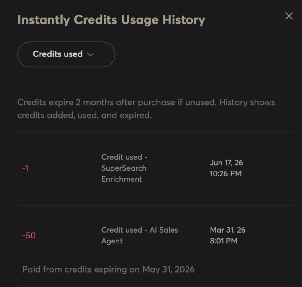 Instantly credit usage history filtered to credits used, showing a 1-credit SuperSearch enrichment charge and a separate 50-credit AI Sales Agent charge.